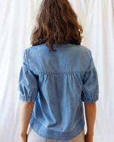 Downeast Portside Chambray Popover tops, lightweight button-up shirt with collar, long sleeves, and casual fit, displayed on a hanger.