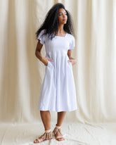 Downeast countryside dress featuring a flowy, floral design with a fitted waist and short sleeves, perfect for casual wear.