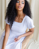 Downeast Countryside Dress displayed on a hanger, featuring a floral pattern and lightweight fabric ideal for casual wear.