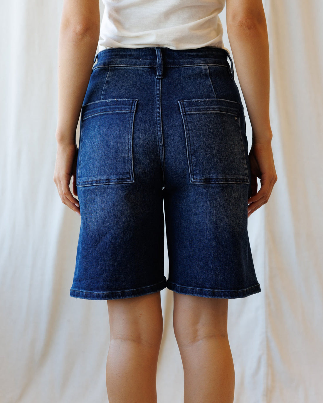 DownEast cabana shorts, lightweight casual shorts with a relaxed fit, shown in a neutral color on a hanger.
