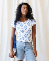 Downeast Artistic Tee showing a colorful, abstract design on a casual top, displayed on a plain background.
