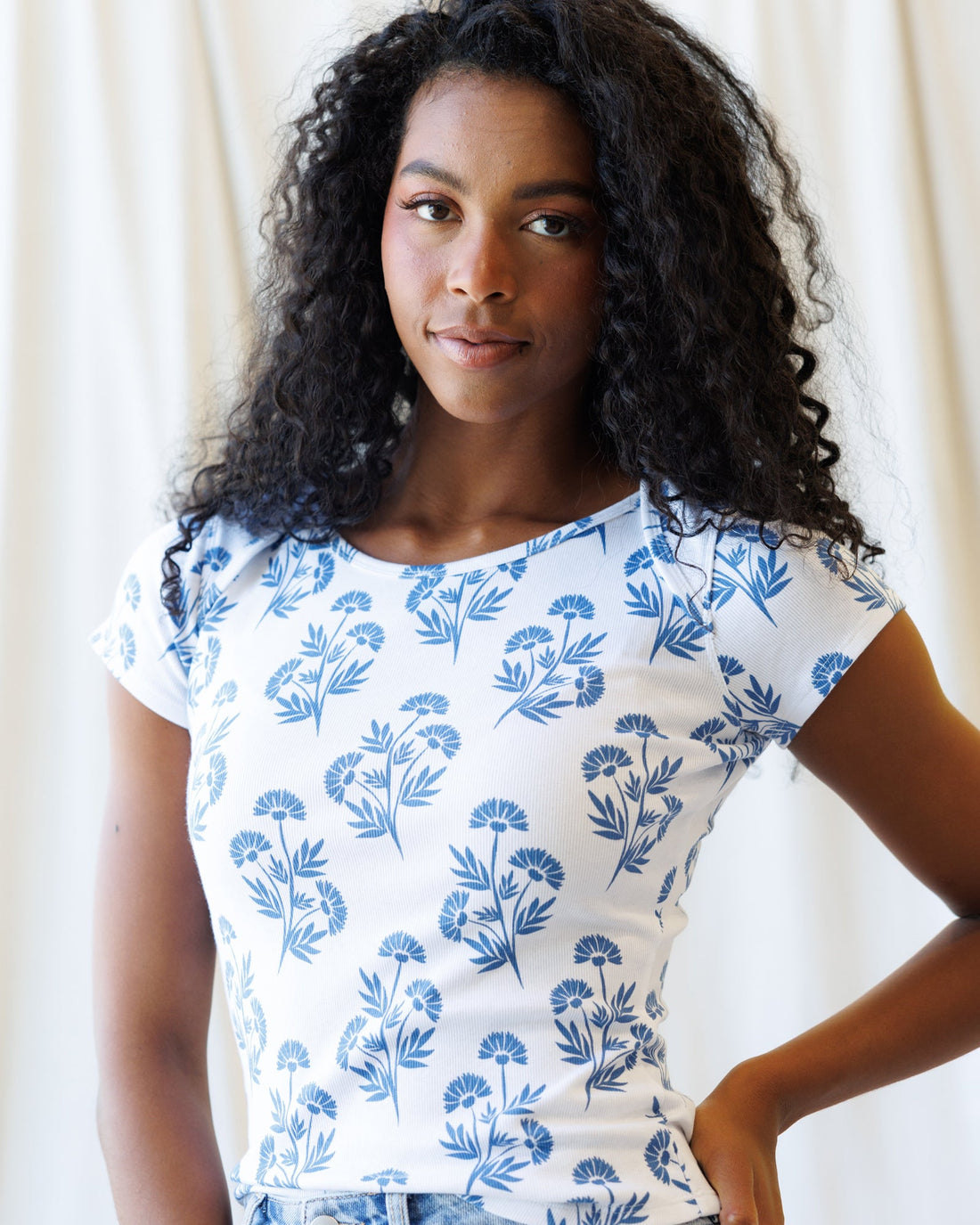 Downeast Artistic Tee tops featuring a colorful, artistic print on soft fabric, displayed on a neutral background.