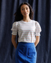 Downeast Tres Belle Top in soft, lightweight fabric with a stylish neckline, displayed on a hanger.