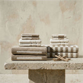 Italic Pietra Australian Cotton Towels folded on a surface, showcasing soft, plush texture and high-quality cotton material.