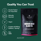 August Uncommon Tea Low Country Bourbon Sugar Black Tea in a glass cup showing dark brewed tea with rich color