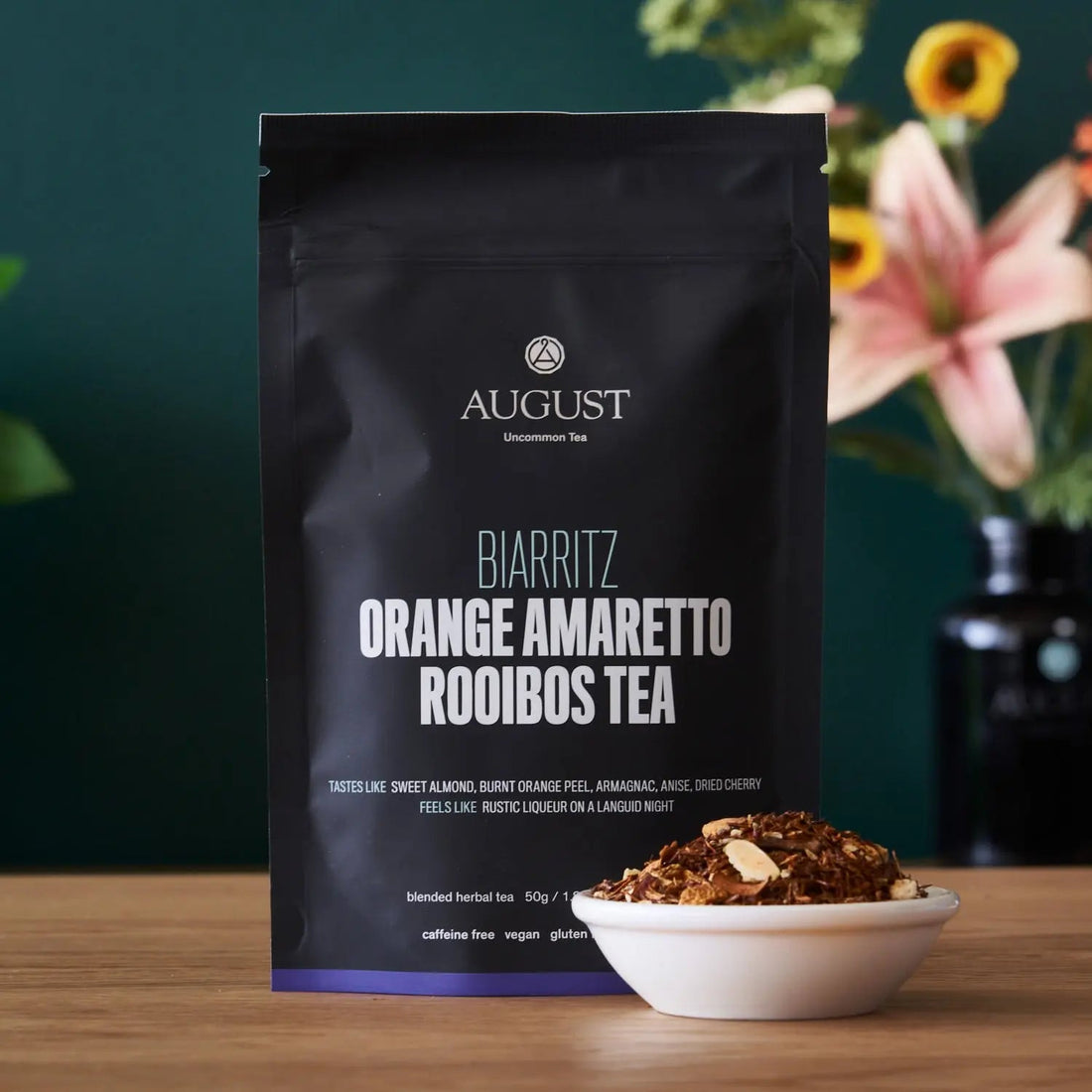 Biarritz Orange Amaretto Rooibos herbal tea bag from August Uncommon Tea, caffeine-free beverage with bright orange and herbal notes.