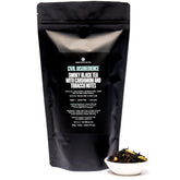 Civil Disobedience Smoky Cardamom Black Tea in a 70-cup bag by August Uncommon Tea, featuring dark tea leaves with hints of smoky and cardamom aroma.