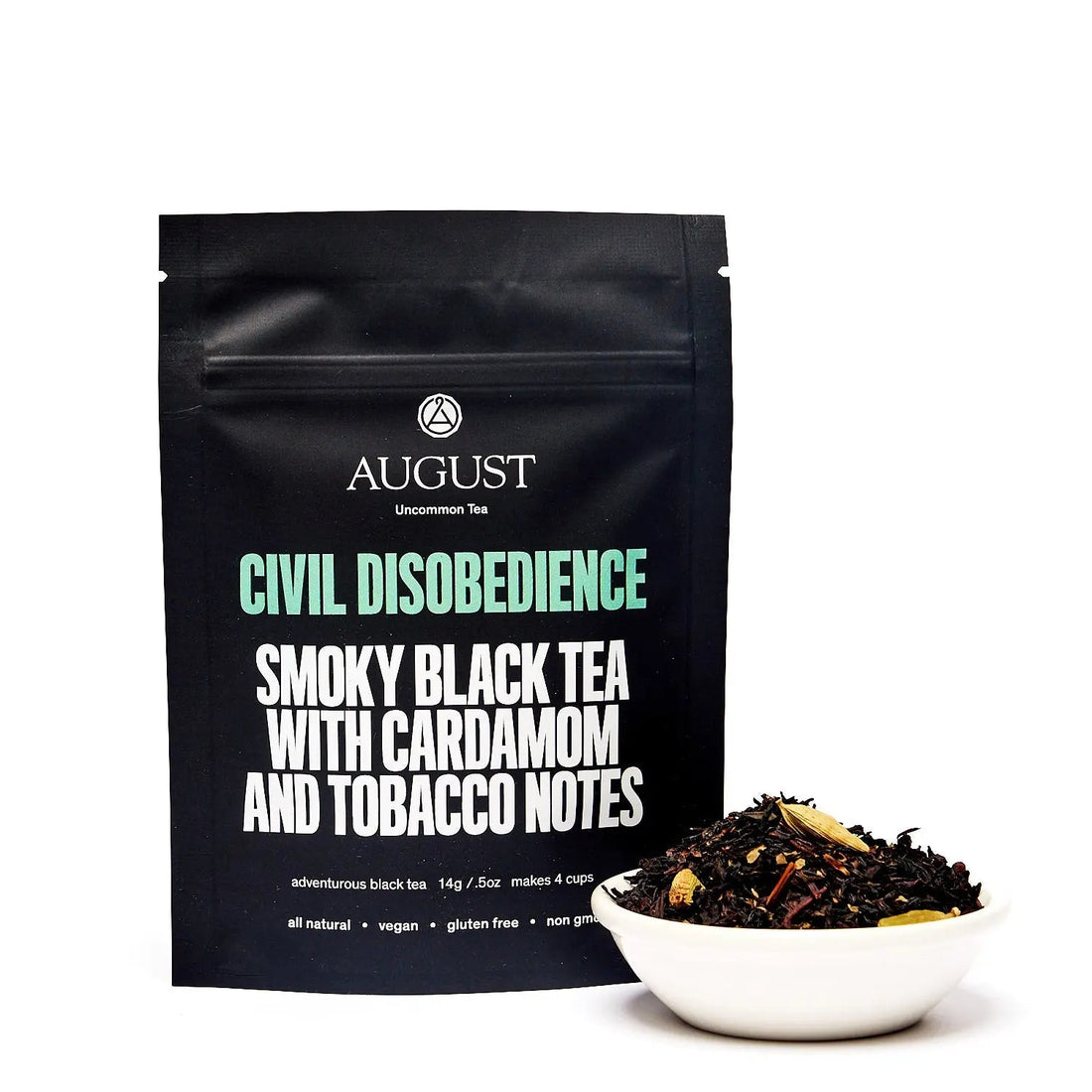 Four cups of Civil Disobedience Smoky Cardamom Black Tea by August Uncommon Tea, showcasing the rich, dark brewed tea in a cozy setting.