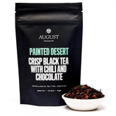 Painted Desert Chocolate Chili Black Tea from August Uncommon Tea in a 15-cup bag, showcasing rich black tea with chocolate and chili notes.