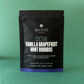 Herbal tea in a cup featuring vanilla, grapefruit, and mint flavors from August Uncommon Tea&