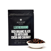 Leatherbound sample box of The Library Malty Black Tea from August Uncommon Tea, featuring four black tea cups.
