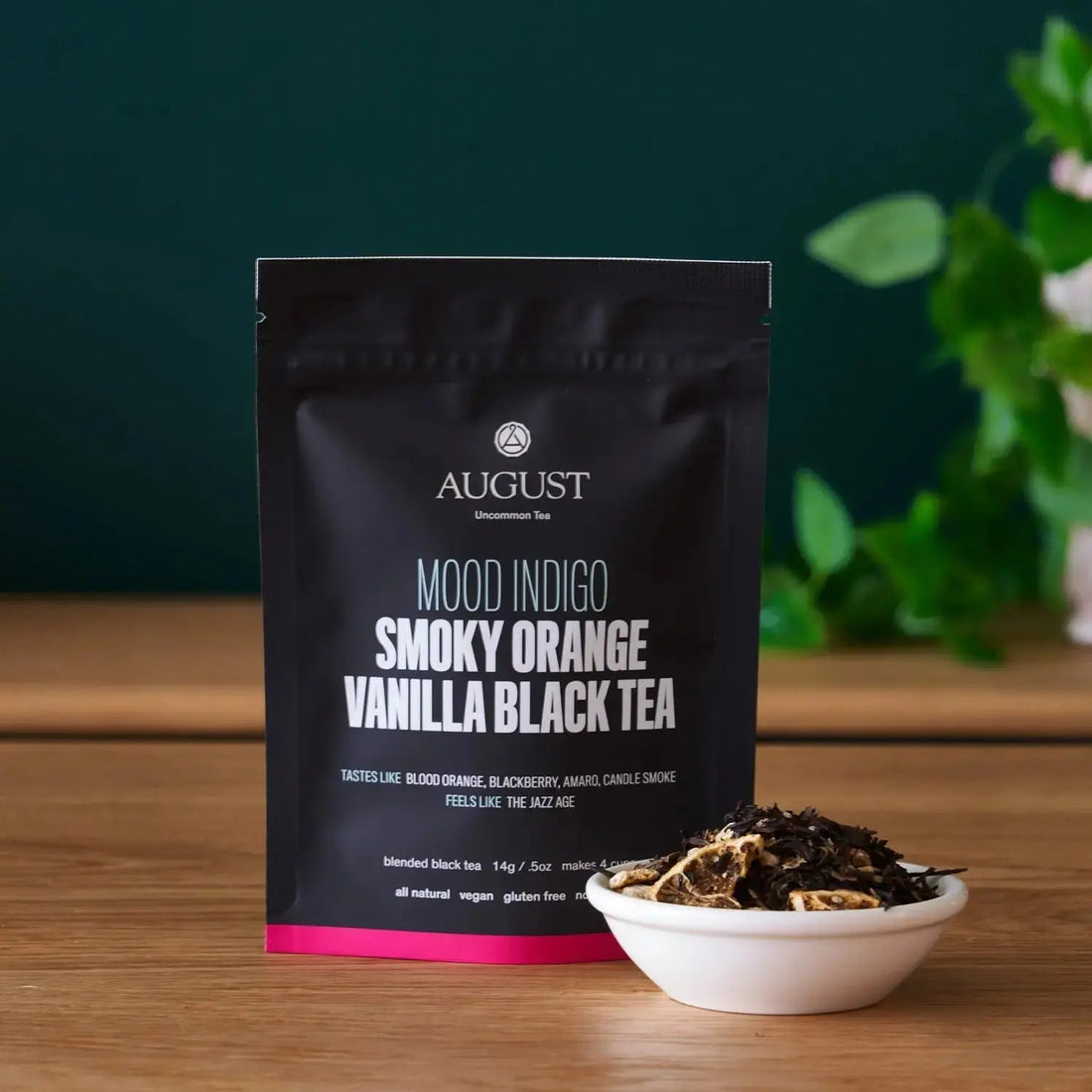 Smoky orange vanilla black tea in a cup, featuring deep amber color and aromatic notes, from August Uncommon Tea Mood Indigo collection.