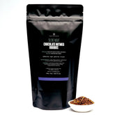 Herbal tea bag of Silent Night Chocolate Nutmeg Rooibos by August Uncommon Tea, caffeine-free herbal beverage in a 70-count package.