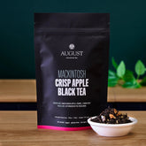 Mackintosh Crisp Apple Black Tea bag from August Uncommon Tea, black tea with apple flavor, ready for brewing in a 15-cup package.