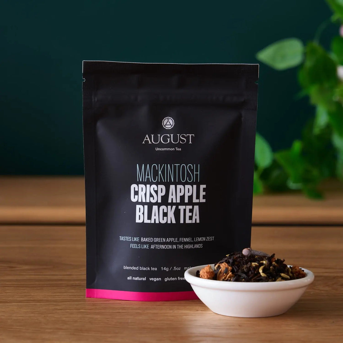 Four cups of August Uncommon Tea Mackintosh Crisp Apple Black Tea, a flavorful black tea beverage with apple notes.