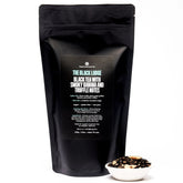 Smoky Banana Black Tea from August Uncommon Tea in a 70-cup bag, featuring dark black tea leaves with hints of banana flavor.