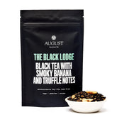 Smoky Banana Black Tea from August Uncommon Tea in a 15-cup bag, featuring black tea with smoky and banana flavors.