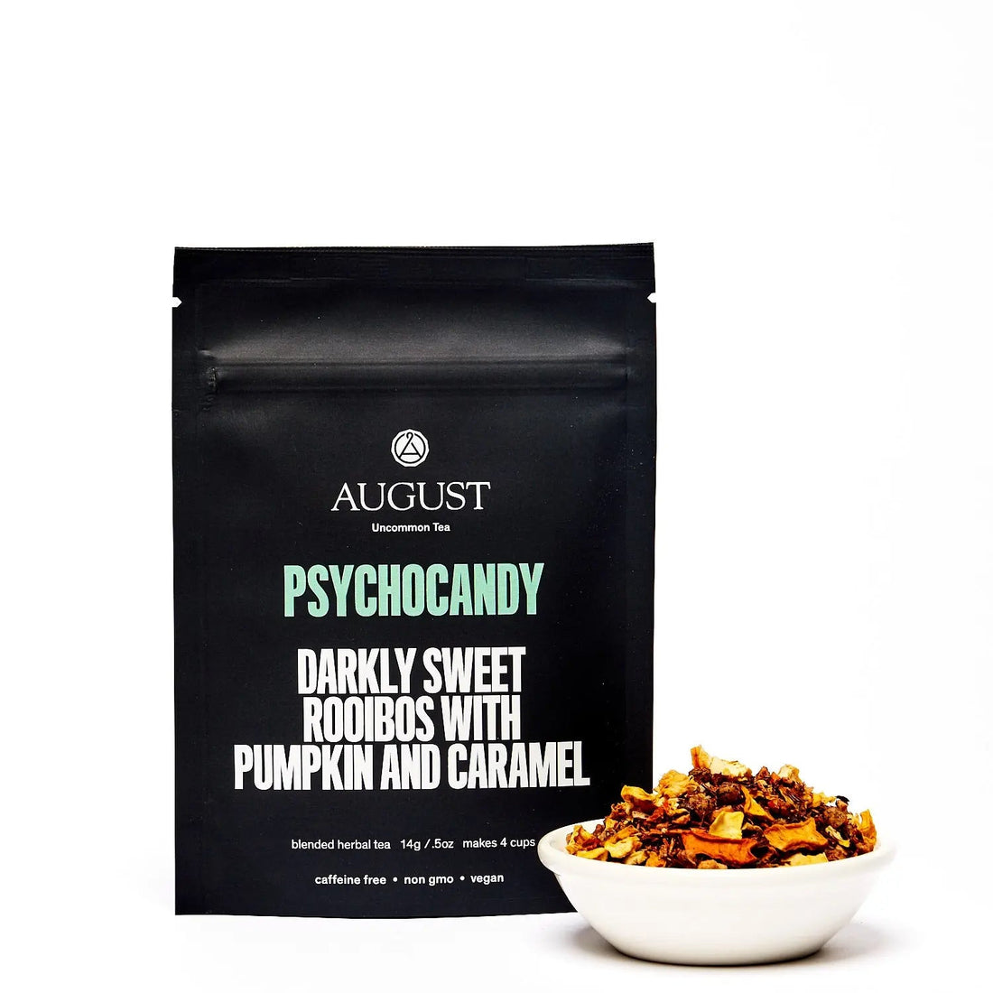 Four cups of August Uncommon Tea Psychocandy Roasted Pumpkin Caramel Rooibos herbal tea, caffeine-free beverage with warm, rich tones.
