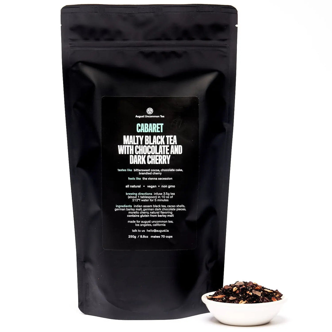 Bag of August Uncommon Tea Cabaret Cherry Chocolate Black Tea, a rich black tea blend in a resealable bag.
