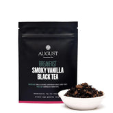 Smoky vanilla black tea from August Uncommon Tea, brewed in a cup with a dark amber color and aromatic vanilla aroma.