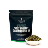 Neon Forest Apple Chamomile Green Tea from August Uncommon Tea, four-cup deluxe sample with vibrant packaging and tea leaves.