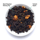 Close-up of burnt apple oolong tea leaves from Avalon by August Uncommon Tea, showing dark rolled oolong leaves with burnt apple aroma.