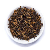 Single estate Nepalese black tea leaves from Rare Leaves Gold by August Uncommon Tea, showcasing rich, dark tea leaves.