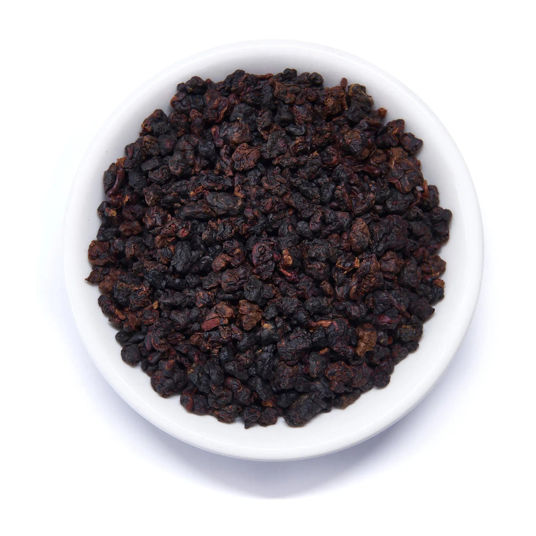 Dark roasted Taiwanese oolong tea leaves from Rare Leaves Black Pearl by August Uncommon Tea, showcasing glossy, tightly rolled dark leaves.