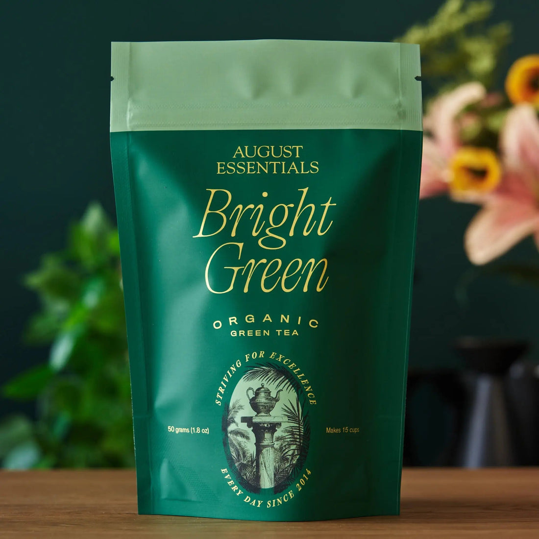 Bright green tea bag of August Uncommon Essentials Bright Green Green Tea, fresh green tea leaves in a sealed package.