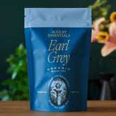 Essentials Earl Grey black tea bag from August Uncommon Tea, shown in a 15-cup package, ready for brewing.