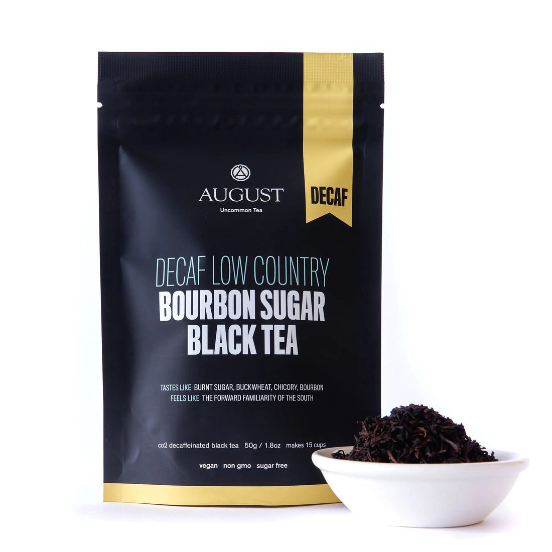 Decaf Low Country Bourbon Sugar Black Tea bag from August Uncommon Tea with dried tea leaves, perfect for brewing a rich black tea.