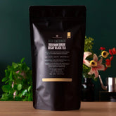 Decaf Low Country Bourbon Sugar Black Tea bag from August Uncommon Tea, featuring rich black tea with bourbon and sweet sugar notes.