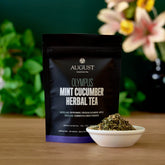 Olympus Mint Cucumber Herbal Tea by August Uncommon Tea in a teacup, showcasing fresh mint and cucumber ingredients.