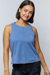 Goal Five boxy crop tank top, light fabric, relaxed fit, white color, styled with casual clothing, close-up shot.
