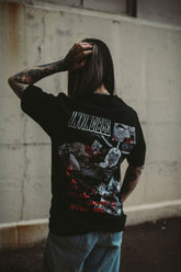 Black Neck Snap T-Shirt from Any Means Necessary Clothing, featuring a crew neck and snap button details.