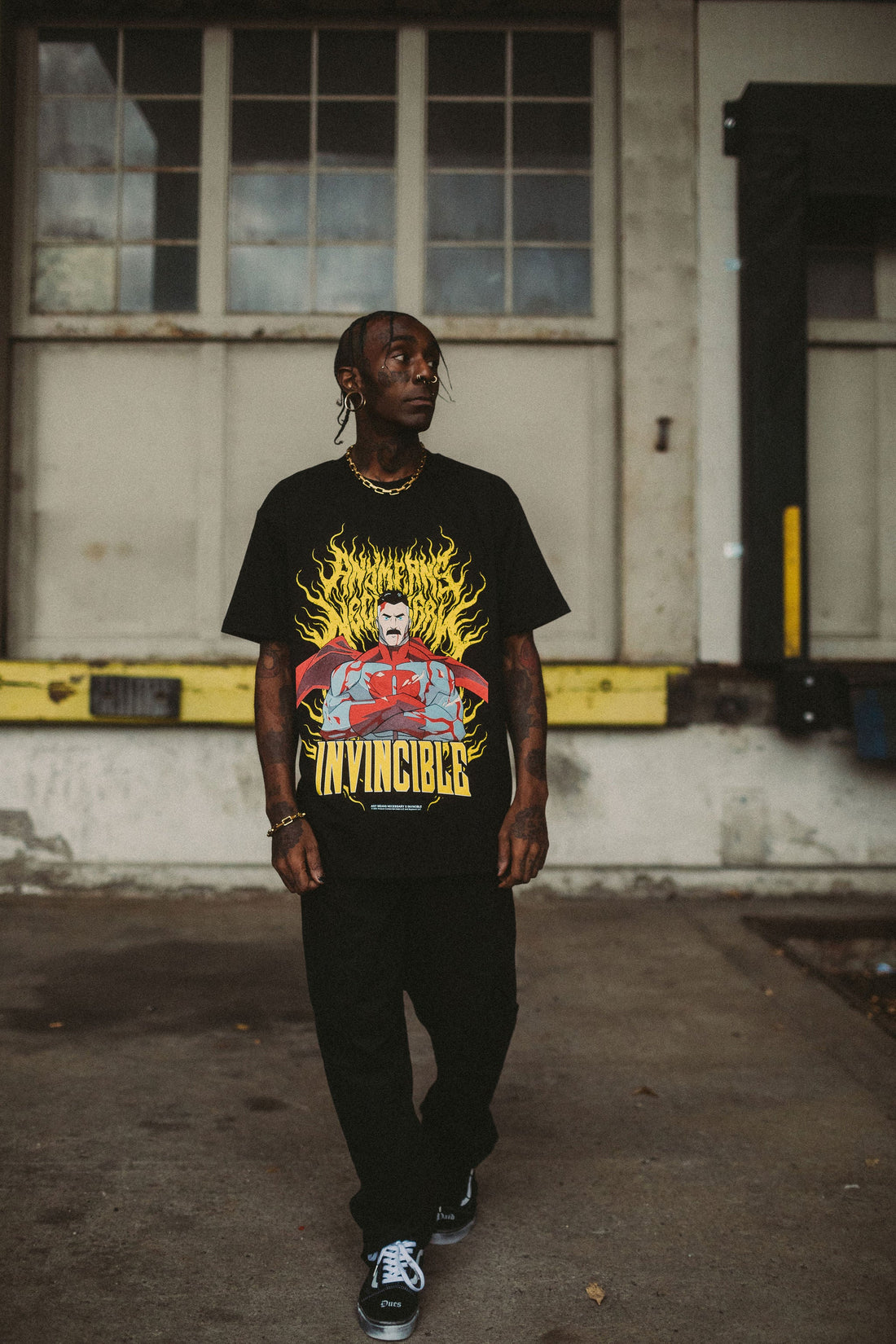 Omni-Man T-shirt from Any Means Necessary Clothing featuring a graphic print of Omni-Man superhero on front.