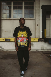 Omni-Man T-shirt from Any Means Necessary Clothing featuring a graphic print of Omni-Man superhero on front.