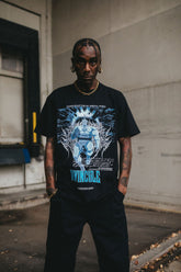 Any Means Necessary Clothing Arrival T-Shirt in black, featuring a front graphic design and casual fit.