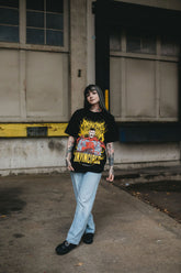 Omni-Man T-shirt from Any Means Necessary Clothing featuring graphic print of Omni-Man superhero character.