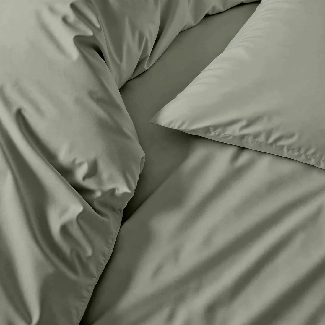 Italic Luxe Australian Sateen Sheet Set on a bed showcasing smooth, silky bed sheets in a cozy bedroom setting.