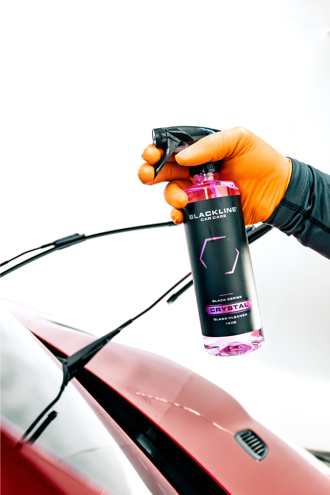 Blackline Car Care BLACKLINE® Crystal Glass Cleaner spray bottle with clear liquid for cleaning car windows and glass surfaces.
