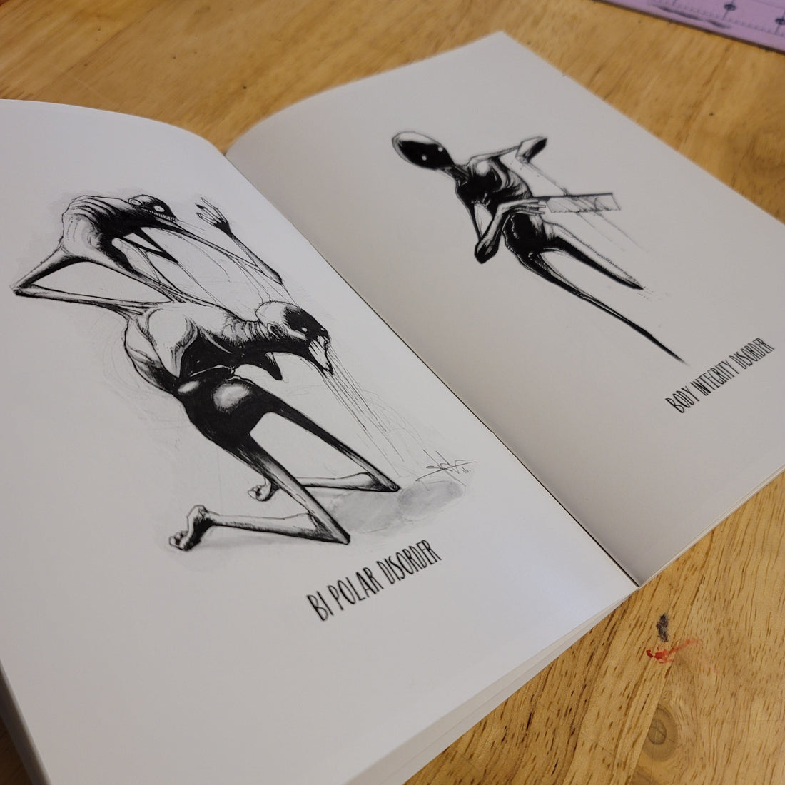 Inktober Illness softback book by Any Means Necessary Clothing, featuring colorful illustrations from the complete collection.