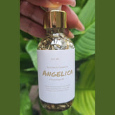 Rich Bitch Conjure Angelica Cleansing Oil, hoodoo oil with herbal ingredients, in a clear glass bottle with dropper cap.