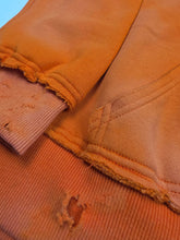 Orange Trophy Pullover Hoodie by Any Means Necessary Clothing, front view showing the hoodie’s design and comfortable fit.