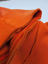 Orange Trophy Pullover Hoodie by Any Means Necessary Clothing, featuring a casual fit and comfortable fabric, displayed on a hanger.