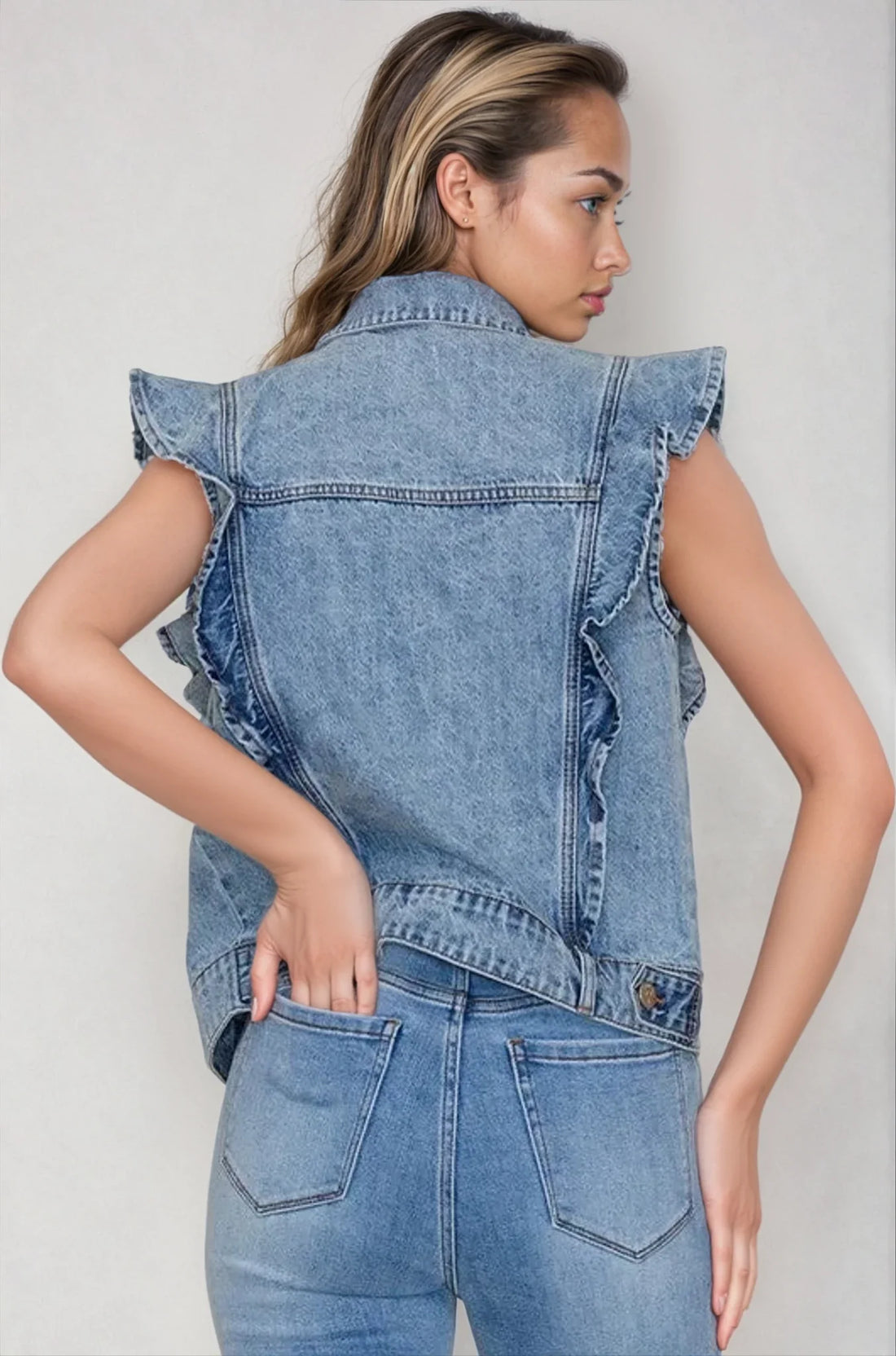 Light denim Victorian charm ruffle-trim sleeveless vest jacket by Fitkitty Culture, featuring statement ruffles and classic denim design.