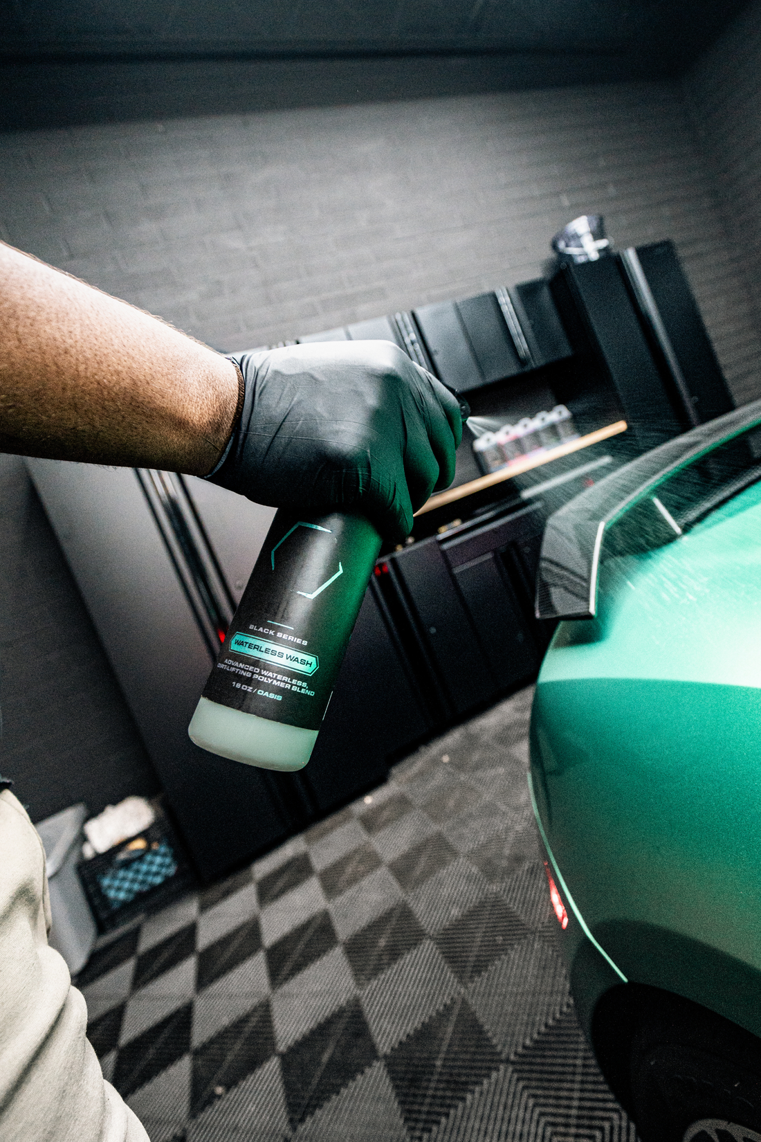Blackline Car Care BLACKLINE® Waterless Wash bottle with cleaning solution, used for eco-friendly vehicle exterior cleaning.