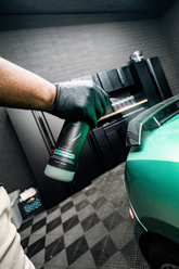 Blackline Car Care BLACKLINE® Waterless Wash bottle with cleaning solution, used for eco-friendly vehicle exterior cleaning.