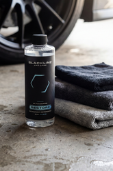 Blackline Car Care BLACKLINE® Restore microfiber detergent container with label for cleaning microfiber towels and cloths.