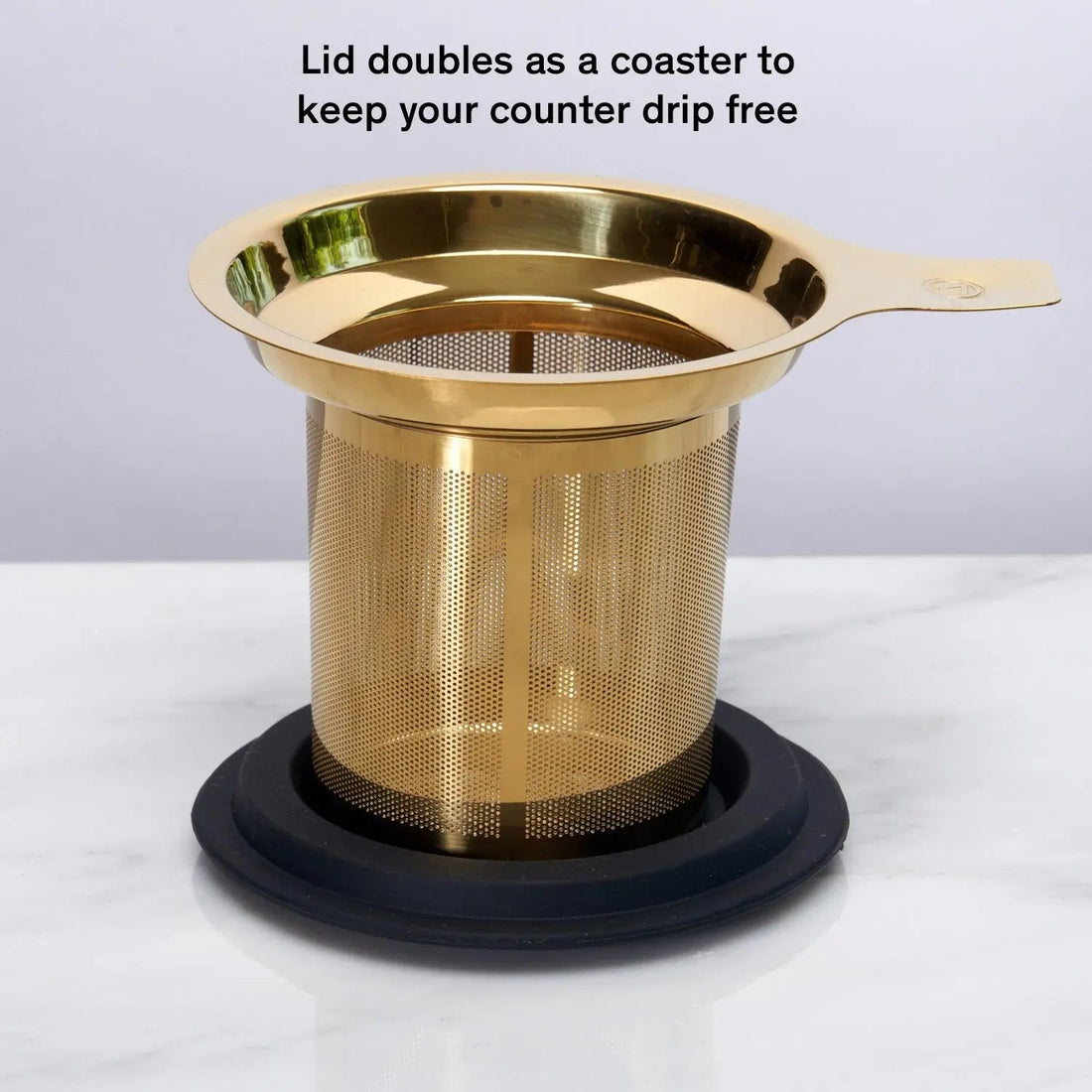 Gold one-cup tea infuser by August Uncommon Tea with a lid, perfect for brewing loose leaf tea in a single cup.